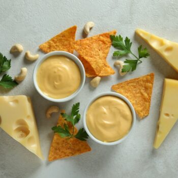 cheesesauceandsnacksonwhitetexturedtable